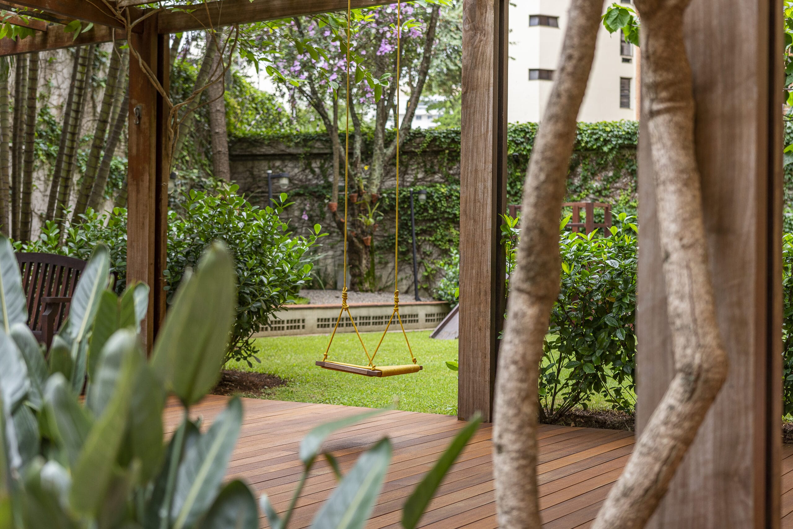 Swing in a garden with blurred greenery, showcasing tranquility and nature, related to home renovations Tampa FL.