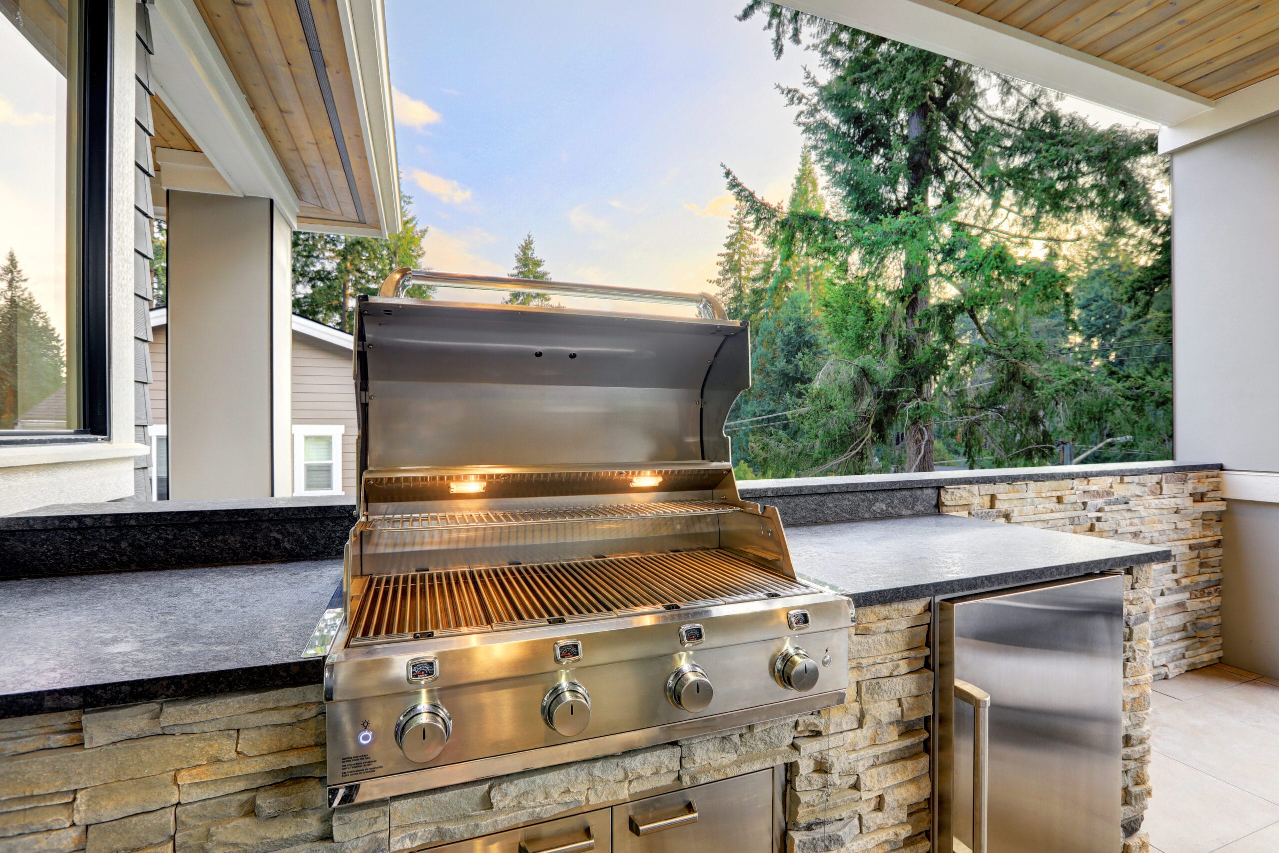 Opened barbecue grill on an outdoor patio, emphasizing home renovations Tampa FL with a focus on outdoor living spaces.
