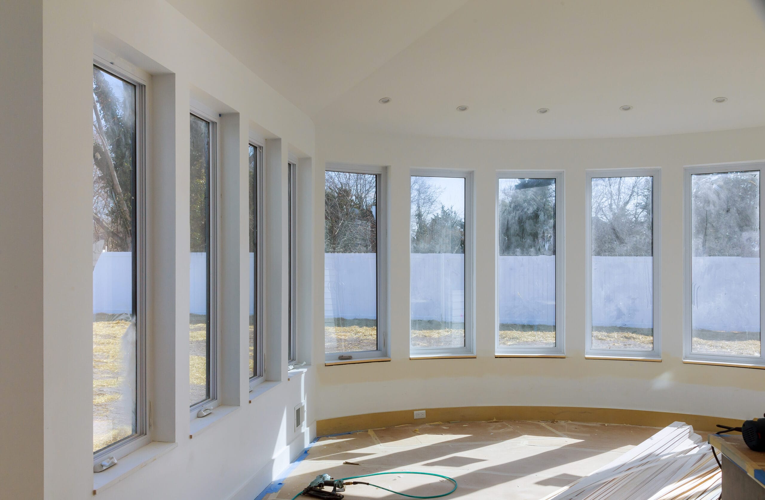 Modern kitchen under construction with white cabinets and stainless steel appliances, part of home renovations Tampa FL.