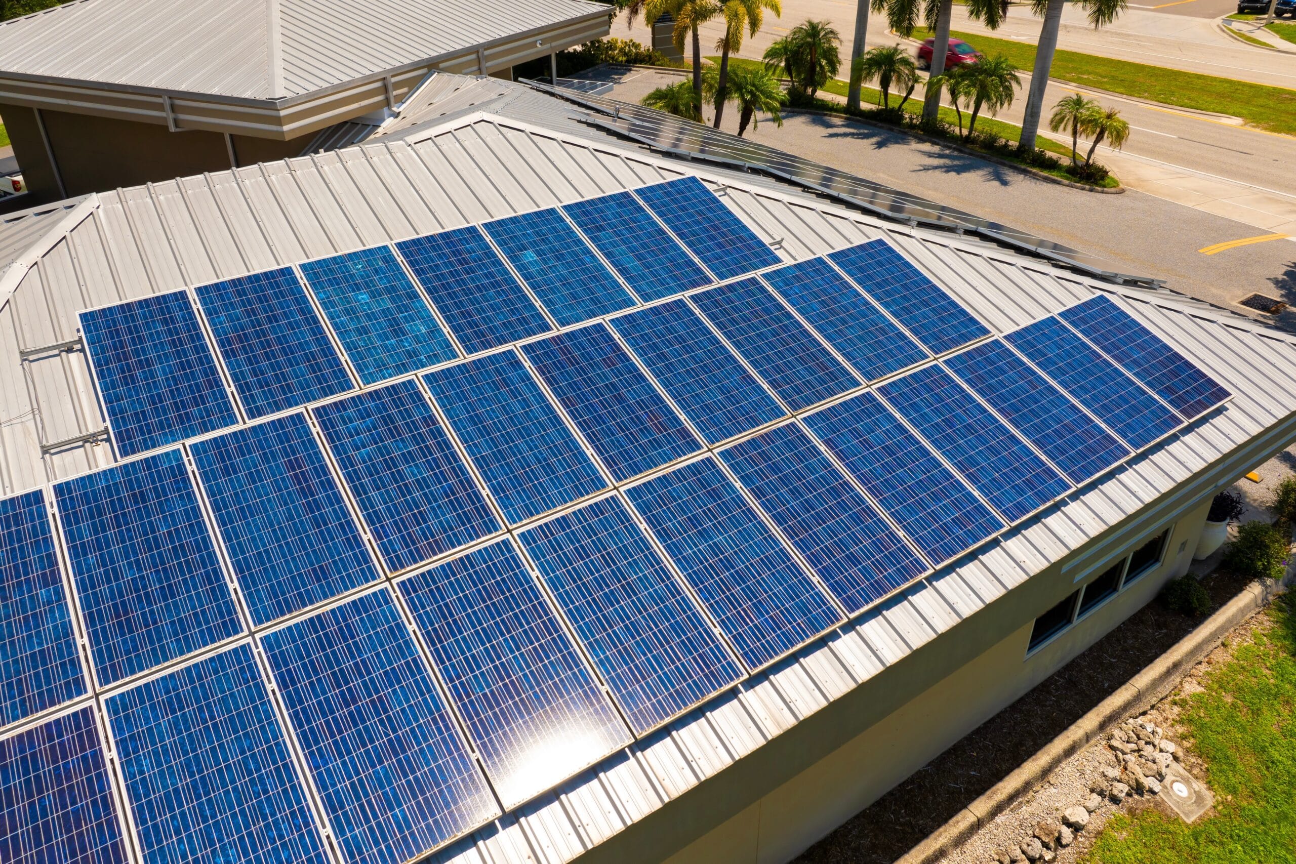 Solar photovoltaic panels mounted on a house roof, capturing sunlight for clean energy production.